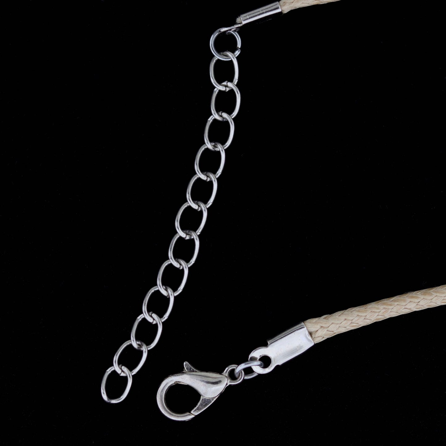 Silver chain with clasp on a black background